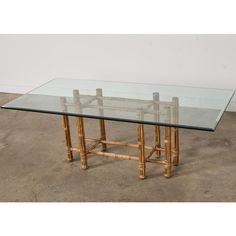 a glass table topped with bamboo sticks