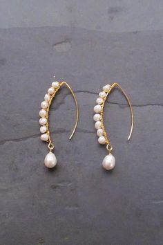 Long Baroque Pearl earrings. These long pearl earrings are made with cultured baroque freshwater pearls attached to a long earhook.  #dropearrings #earrings #pearljewelry #threaderearrings #hoopearrings Diy Back Drop Necklace, Wire Hoop Earrings Diy, Delicate Baroque Pearl Earrings For Pierced Ears, Delicate Pearl Earrings With Ear Wire, Long Drop Pearl Earrings With Ear Wire, Baroque Pearl Drop Dangle Earrings, Pearl Linear Long Drop Earrings, Long Drop Pearl Linear Earrings, Handmade Delicate Baroque Pearl Earrings