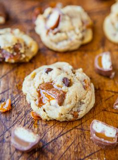 cookies with caramel and white chocolate chips on a cutting board, ready to be eaten