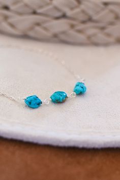 "This Turquoise necklace is the perfect gift for you or a loved one with a December Birthday. These vibrant blue stones are AAA (highest quality) Turquoise. Wrapped with 3 stones, the magical number 3 symbolizes harmony, wisdom & the divine within. Turquoise is the Stone of Truth, reminding you of what you already know...you are enough. This necklace is the perfect layering necklace. Models are wearing 16\" in photos. ▲ Turquoise nugget stones ▲ Sterling silver cable chain ▲ Comes gift-ready December Birthday, Blue Stones, Necklace Turquoise, Necklace Minimalist, Jewelry Sterling Silver, Layering Necklace, Number 3, Raw Gemstones, Vibrant Blue