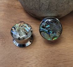 "You will receive a Pair of 316L surgical steel plugs in size 0g 8mm. Plugs have colorful abalone shell inlay. 3/8\" wearable length Screw Fit for easy on and off - no o-rings to deal with. Great look for guys or girls! High quality, 316L surgical steel plugs are very safe for stretching ears.  **Hypoallergenic** --Great gift for a friend or yourself! If you want me to include a FREE gift bag, just select the gift message option when you check out." Stretching Ears, Ear Stretching, 00 Gauge, Gauge Earrings, Plug Earrings, Organic Wood, Tunnels And Plugs, Gauged Earrings, Ear Gauges