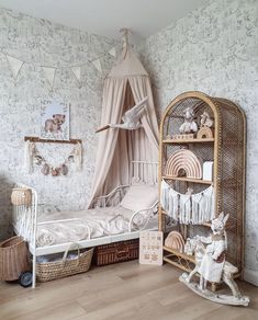 a child's bedroom decorated in pink and white