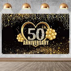 a 50th anniversary party backdrop with balloons and confetti