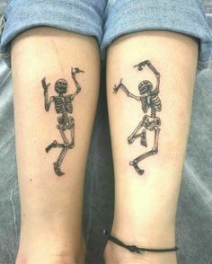 two people with matching tattoos on their legs