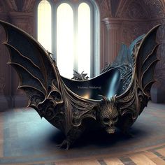 a bat shaped sculpture sitting on top of a wooden floor next to a large window