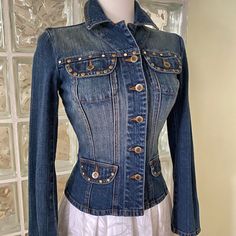 Trendy Bisou Bisou Jean Jacket With Studded And Crystals Embellished At Front And Back Of The Jacket. Size X-Small, Jean Fabric Is Stretchy. Sleeves Are 23” Long, Length Of Jacket Is 19.5” Long, Bust Is 36” Wide. Fitted Blue Embellished Outerwear, Blue Embellished Fitted Outerwear, Fitted Long Sleeve Denim Jacket With Buttons, Fitted Long Sleeve Denim Jacket, Fitted Long Sleeve Denim Jacket With Snap Buttons, Fitted Winter Denim Jacket With Snap Buttons, Fitted Denim Jacket With Snap Buttons For Winter, Embellished Fitted Denim Jacket, Jean Fabric