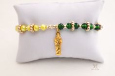 The Saint Jude's Good Fortune Protection Bracelet is a symbol of good luck, prosperity, and protection when it's worn on the wrist. This strong and powerful bracelet not only has a Saint Jude medallion but also has green, yellow, and white crystal beads to bring more good luck and fortune into your life. It's perfect for people of all faiths and traditions. Saint Jude is the Patron of Lost Causes. This protection bracelet with meditation beads will empower your mind, body, and soul. With healing Handmade Green Spiritual Rosary Bracelet, Adjustable Green Rosary Bracelet With Round Beads, Green Spiritual Rosary Bracelet With Round Beads, Spiritual Green Rosary Bracelet With Round Beads, Green Spiritual Bracelets With 8mm Beads, Symbolic Green Jewelry For Good Luck, Yellow Spiritual Stretch Bracelet, Adjustable Green Spiritual Rosary Bracelet, Green Beaded Spiritual Rosary Bracelet