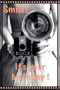 a woman holding an old camera with the words smile it's your birthday