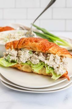 a chicken salad sandwich on croissants with celery