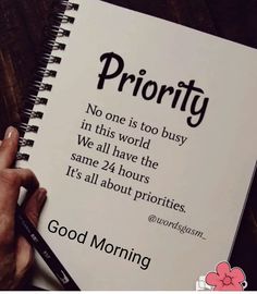 someone is writing on a notebook with the words priority written in black and white ink