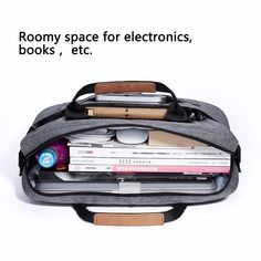 an open laptop bag sitting on top of a white table next to books and pens