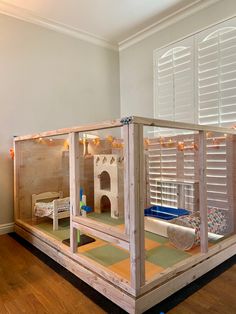 a child's play house made out of wood