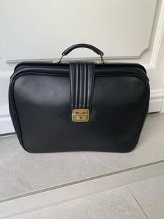 A very elegant and neat black briefcase from the 70s. Very chic and trendy W=45 cm H=33 cm D=10 cm You can count on careful packaging and proper delivery! Retro Formal Satchel Briefcase, Vintage Rectangular Briefcase For Business Trips, Black Rectangular Briefcase For Formal Use, Formal Black Rectangular Briefcase, Vintage Black Briefcase For Formal Use, Retro Black Office Satchel, Retro Black Satchel For Office, Retro Rectangular Briefcase For Business, Vintage Rectangular Briefcase For Formal Use