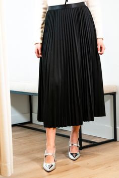 Get ready for an evening out with our Victoria skirt. Featuring a luxurious black accordion pleated design, this midi length skirt exudes elegance and refinement. Elevate any outfit with this chic and sophisticated piece. Elastic satin waistband Mary Grace is wearing XS/S with a 32B bust, 25” waist and 36” hip. 95% Polyester, 5% Spandex Hand wash cold and line dry Sleek Formal Skirt For Spring, Sleek Formal Spring Skirt, Midi Pleated Skirt For Evening, Pleated Midi Skirt For Evening Events, Pleated Midi Maxi Skirt For Party, Evening Long Pleated Skirt With Folds, Chic Flowy Maxi Skirt With Folds, Chic Pleated Skirt With Lined Detail For Date Night, Chic Lined Pleated Skirt For Date Night