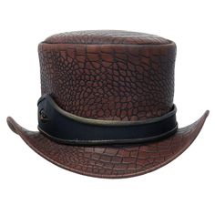 Brown dragon tophat with eye hatband and crocodile / dragon embossed leather crown. This eyeball steampunk tophat has a universal fitting inside hatband for a more comfortable fit. A brown tophat with eye that is one hat to watch (unless it's watching you), and is made of 4-5 oz. top grain cowhide leather. Sizes: S, M, L. [5#] right side crocodile / dragon eye crocodile embossed leather crown and bill perforated crown for added breathability golden trim on eye filled hatband 5 inch tall crown tassel on back universal stretch headband inside top grain leather heavy 4-5 oz. cowhide leather IMPORTANT SPECIFICATIONS: MANUFACTURER: This quality product is a Jamin Leather® brand or other reputable brand that matches or exceeds our quality standards, for the price.LEATHER: Cowhide is a standard p Brown Steampunk Brimmed Top Hat, Steampunk Adjustable Top Hat With Flat Brim, Steampunk Top Hat With Adjustable Flat Brim, Steampunk Leather Top Hat With Flat Crown, Brown Steampunk Top Hat With High Crown, Steampunk Brown Leather Top Hat, Brown Adjustable Top Hat For Halloween, Adjustable Brown Top Hat With High Crown, Adjustable Brown Top Hat For Halloween