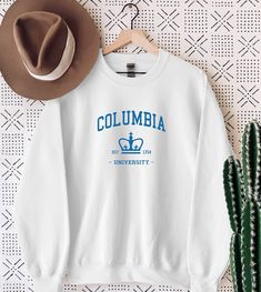 Columbia University Sweatshirt, Columbia University Est 1754 College Student, University Sweatshirt, Custom University College Sweatshirt WELCOME TO "StyleDesignUS" High quality and super soft, comfortable Sweatshirt and Hoodies. Made with top of the line vinyl and pressed with a professional grade heat press. SIZING AND COLORS Make sure you check our size-chart before you place your order. If you are not sure about sizing please measure your favorite Sweatshirt or Hoodie and compare measurement Crew Neck T-shirt With University Logo For Fall, Long Sleeve Cotton T-shirt With University Logo, White Crew Sweatshirt For Campus, White Crew Neck Sweatshirt For Campus, University Logo Crew Neck Top For Fans, University Logo Crew Neck Top Fan Apparel, University Logo Crew Neck Top, White Crew Neck T-shirt For Campus, Collegiate White Crew Neck T-shirt