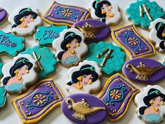 some decorated cookies with princesses on them