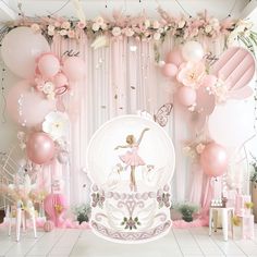 a room filled with balloons, flowers and other items for a ballerina themed birthday party