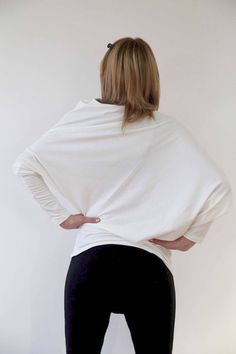 A personal favorite from my Etsy shop https://www.etsy.com/listing/533206093/asymmetric-tunic-ivory-tunic-loose-top White Asymmetrical Top For Fall, Chic White Draped Top, Modern Asymmetrical Tops For Layering, Chic Asymmetrical Relaxed Fit Top, Fitted Asymmetrical Lagenlook Top, Versatile Wrap Top For Loungewear, White Asymmetrical Stretch Tops, White Fitted Draped Top, White Asymmetrical Top With Relaxed Fit