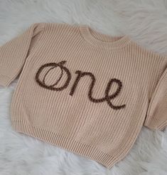 Oversized embroidered sweater for first birthday. One with the o as a pumpkin. Message me for other wording options! Oversized Letter Embroidery Sweater For Fall, Oversized Fall Sweater With Letter Embroidery, Pumpkin Embroidery Sweater, Embroidered Baby Sweater, Newborn Embroidered Sweater, Birthday Sweater, Pumpkin 1st Birthdays, Sweater Pumpkins, October Baby