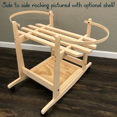 a wooden rack with wheels on the floor