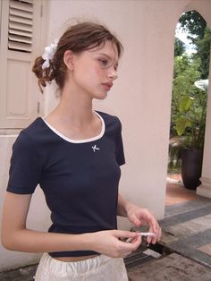 This is a casual and comfortable t-shirt that is made out of high quality cotton, polyester, and spandex blend fabric. With design detail of rose label detail and color blocked detail on the neckline, it gives a trendy and casual look. - Color blocked neckline- Slim silhouette- Small ribbon embellishment- Rose label detail Casual Stretch T-shirt With Contrast Color, Short Sleeve Stretch T-shirt With Contrast Color, Stretch T-shirt With Contrast Color And Short Sleeves, Contrast Color Stretch T-shirt With Short Sleeves, Fitted Contrast Color Short Sleeve T-shirt, Short Sleeve T-shirt With Contrast Trim For Spring, Casual Spring T-shirt With Contrast Trim, Fitted Cotton T-shirt With Contrast Color, Fitted T-shirt With Contrast Color