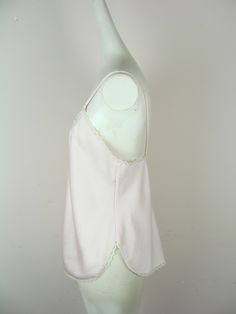 "Beautiful vintage light pink lace trim camisole from the 70s. Features a v neckline with 1.5\" white floral lace trim with faux pearls, spaghetti straps and a straight silhouette with a slightly curved hemline that goes up on the sides. Made of a beautiful lightweight light pink material with small rectangle dot designs woven throughout and .5\" white scalloped edge lace trim along the hemline, and the sides and back of the neckline. Label: \"Indulgence\". Made in U.S.A. Fiber content: 100% pol Pink Lace Trim Camisole With Spaghetti Straps, Pink Cotton Camisole With Lace Trim, Pink Fitted Vintage Camisole, Vintage Pink Sleeveless Camisole, Vintage White Lace Trim Camisole, Vintage Maxi Skirt, Pink Prom, Dots Design, Wiggle Dress