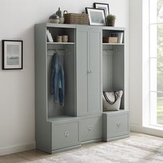 a large gray cabinet with two doors and drawers