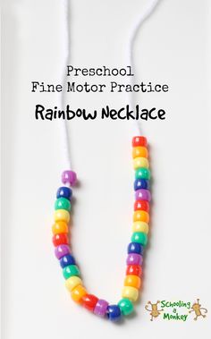 a rainbow necklace with white string and beads on it that says preschool fine motor practice rainbow necklace