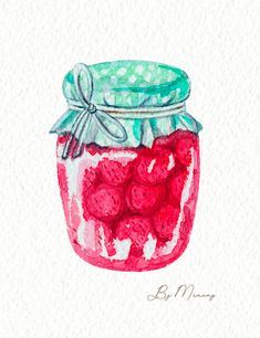 a jar filled with raspberries sitting on top of a table