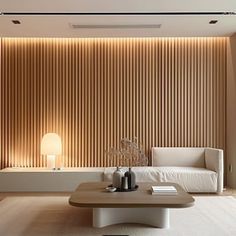 a living room filled with furniture and a large window covered in wooden slatted blinds