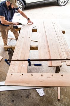 a man is working on some wood