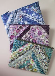 several different types of fabric are stacked on top of each other with zippered closures