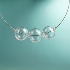 "This Clear glass ball necklace is made of glass in the lampwork technique, each bead is hand blown and unique. This bold chunky necklace is lightweight, stylish and elegant and will become a versatile and irreplaceable addition to your everyday outfits! 💕 You will definitely look stunning in this glass bubble necklace! Dimensions: the necklace length is not adjustable and is 17 3/4\" inch (45 cm). Materials: artist lampwork glass beads, metal fittings. 🎁 This big bead necklace will also be a Clear Glass Beaded Necklaces, Clear Glass Necklace For Jewelry Making, Clear Glass Round Bead Necklaces, Clear Glass Round Beads Necklaces, Clear Glass Necklaces With Round Beads, Clear Glass Necklaces For Jewelry Making, Modern Handmade Clear Necklaces, Modern Glass Necklaces With Round Beads, Modern Glass Round Bead Necklaces