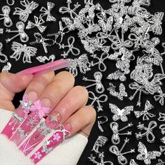 PRICES MAY VARY. √【50pcs Random Styles Bow Butterfly Nail Accessories】50 pieces / pack of random mixed nail accessories set, composed of different styles of butterflies and bows, the style and quantity of nail jewels in the set are random, so the specific style and quantity of nail accessories in each package is uncertain. √【Shiny Alloy Metal Nail Jewels for Nail Art Decoration】Our butterfly nail charms and nail bows are made of premium alloy, they are hard and not easily break, with fine workma Makartt Nails, Nail Bow, Butterflies Nails, Charms For Nails, Nails Charms, Holloween Nails, Bow Nail, Purple Nail Art, Metal Bow