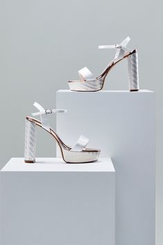 A bridal shoe that wants to have fun, the Nattie platforms are a striking new addition to our wedding shoes collection. Bold and beautiful, these towering heels are crafted from our stylish ivory satin and have a simple strap over the toes and fasten with a buckled ankle strap. With retro, Seventies-inspired undertones, they have a chunky platform sole and block heel wrapped in our new Deco-inspired gold parquet print - making a statement shoe even more statement. #weddingshoes #bridalshoes Comfortable Bridal Shoes, Peep Toe Wedding Shoes, Block Heel Platform Sandals, Beautiful Wedding Shoes, Occasion Shoes, Platform Block Heels, Statement Shoe, Wedding Sandals