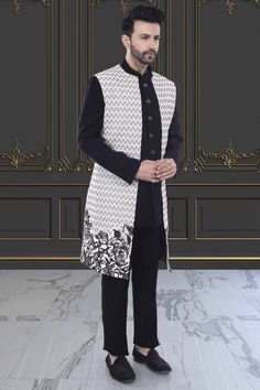 Introducing our R14-S76 Sherwani, a modern and elegant addition to your wardrobe. The unique floral design on the open jacket sherwani exudes sophistication and style. Elevate your look and make a statement with this premium piece. Designer Nehru Jacket For Eid Reception, Designer Bandhgala For Winter Reception, Designer Winter Bandhgala For Reception, Designer Unstitched Bandhgala For Designer Wear, Designer Nehru Jacket With Resham Embroidery, Elegant Formal Outerwear With Chikankari Embroidery, Designer Semi-formal Kurta With Resham Embroidery, Designer Sherwani For Reception In Winter, Semi-formal Fitted Nehru Jacket With Chikankari Embroidery