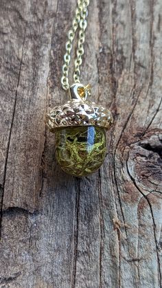 This simple gold necklace contains materials foraged from a forest floor near Crater Lake National Park in Oregon. The delicate neon green moss has been encased in clear resin, to preserve it inside the necklace forever. This acorn shaped pendant hangs on a delicate cable chain that measures 20 inches long, and hangs below the collarbone. The pendant top is also gold-toned, and chain closes easily with a lobster claw clasp.   This unique piece would make the perfect gift for a nature lover in yo Acorn Resin Necklace, Nature Inspired Necklace, Nature Themed Jewelry, Gold Boho Necklace, Nature Themed Gifts, Moss Jewelry, Moss Necklace, Gift For Self, Simple Gold Necklace