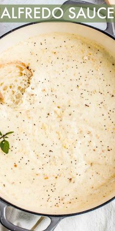 a skillet filled with alfredo sauce and garnished with parsley