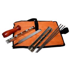 an assortment of kitchen knives and utensils in a pouch on a white background