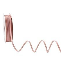 a spool of pink colored wire on a white background