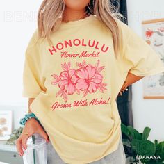 Get ready to be OBSESSED with our new vintage look Honolulu Flower Market Shirt. It's the cutest and most trendy way to emit all those important Aloha and Salty Granola Girl Vibes! This is the perfect Beach Tee! Great as a  gift for all the Coconut girlies out there! * Q U I C K * F A C T S * ✺ 100% preshrunk cotton ✺ Wash and dry normally (on cool for best results) * S I Z I N G * ✺ Models are wearing size XL ✺ Sizing is unisex so runs like men's, though not overly large ✺ Most women find their Honolulu Flower, Coconut Girl Clothes, Salty Granola, Hawaii Crewneck, Hibiscus Shirt, Beach Tee, Coconut Girl, Granola Girl, Aloha Shirt