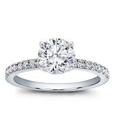 a white gold engagement ring with diamonds on it