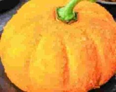 a yellow pumpkin sitting on top of a counter