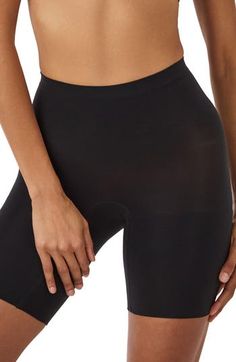 Feel supported in these shaping shorts made with seamless knitting that targets your core for a smooth look that's invisible under clothes. Lined gusset 55% nylon, 45% elastane Machine wash, tumble dry Imported Seamless Knitting, Mid Thigh Shorts, Girl Shorts, Tank Bodysuit, Adhesive Bra, Tennis Skirt, Long Sleeve Bodysuit, Short Girls, Second Skin