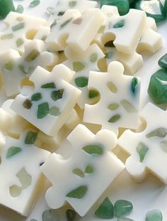 green and white pieces of soap sitting on top of each other