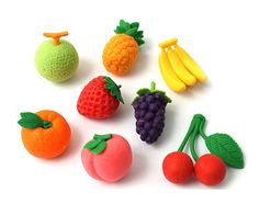 various fruits and vegetables are shown on a white surface