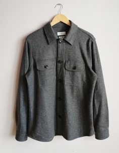 This stylish men's shirt has a slim fit with a tailored silhouette is highly comfortable. Classic Collar Fastening: Button Pockets: Chest pockets Color:Grey Condition: Like New Fabric material: 47% polyester,20% wool,13%cotton, 16 % nylon, 4%viscose Size tag:L *Please check the measurements below to make sure they fit correctly! Total length: 74cm /29.13inch Width (armpit to armpit) : 45cm/17.71inch Arm's length: 67cm / 26.37 inch Shoulders:44 cm/17.32inch ✈Shipping: All items will be shipped vi Winter Shirt With Buttons And Relaxed Fit, Winter Relaxed Fit Shirt With Buttons, Winter Relaxed Fit Shirt, Winter Flannel Shirt With Snap Buttons, Gray Relaxed Fit Shirt With Buttons, Slim Fit Collared Shirt With Pockets, Collared Slim Fit Shirt With Pockets, Classic Slim Fit Tops With Pockets, Winter Shirt With Button Closure And Spread Collar