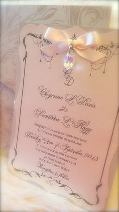 a wedding card with a bow on it