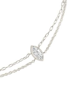 This dainty layered bracelet is the perfect way to add some shine to your look! The CZ center stone is sure to be the perfect finishing touch to any outfit. Available in gold and silver tones. Materials: 14K gold or rhodium plated brass, cubic zirconia Features: Measures 7" with 1" extender, 0.45" bezel CZ stone, 10mm CZ stone, 1mm chain, Lead & Nickel free, lobster clasp Formal Sterling Silver Bracelets With Delicate Chain, Formal Sterling Silver Bracelet With Delicate Chain, Elegant Double Chain Adjustable Bracelet, Elegant Double Strand Bracelet With Delicate Chain, Elegant Double Chain Strand Bracelet, Elegant Double Strand Chain Bracelet, Classic Adjustable Double Chain Jewelry, Elegant Adjustable Sterling Silver Bracelet, Elegant Stackable White Gold Necklaces